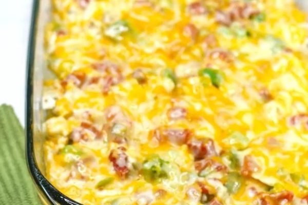 A casserole dish filled with cheese and bacon.