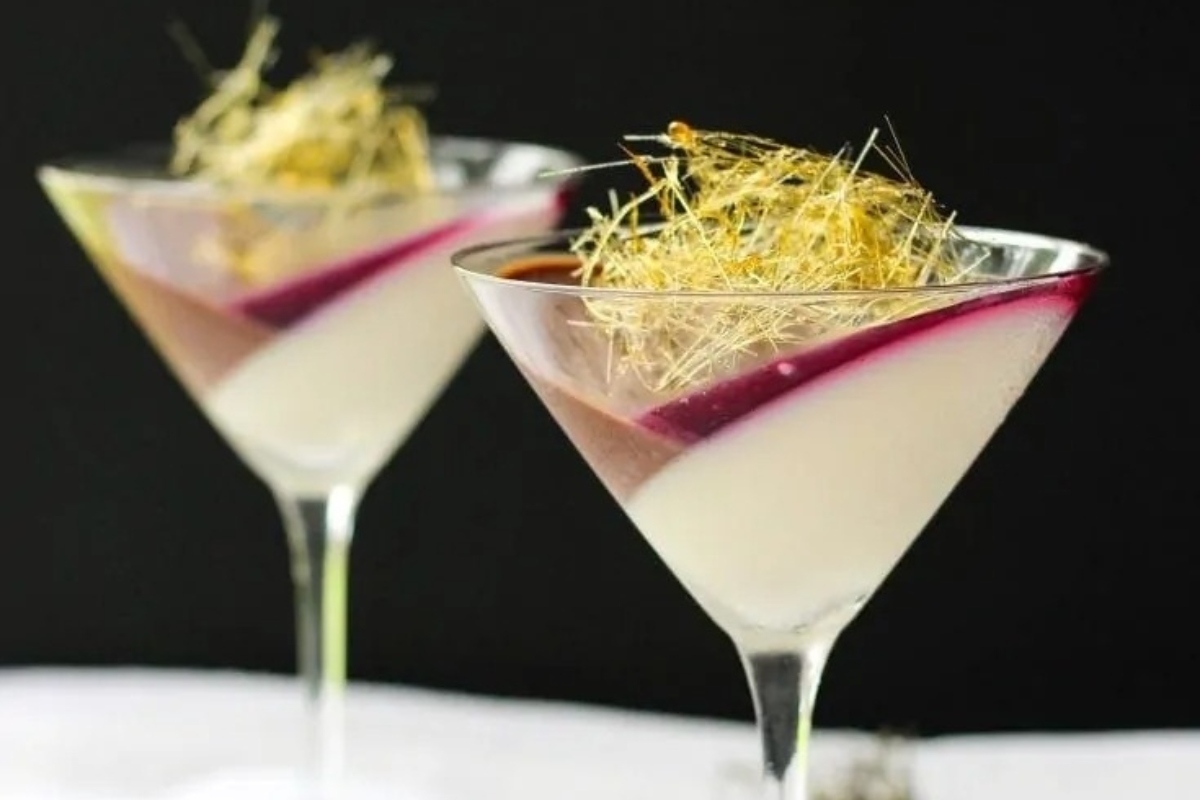 Two Italian martinis with a radish garnish.