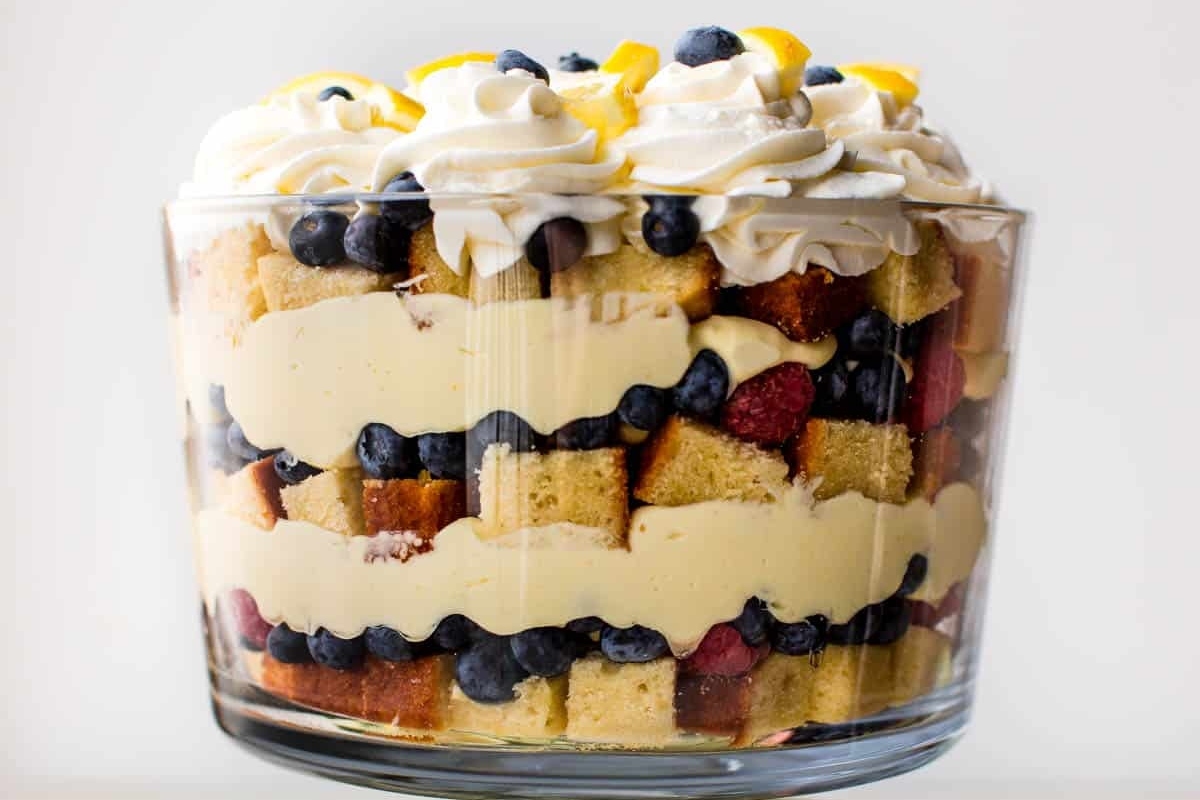 A Christmas trifle filled with fruit and whipped cream.