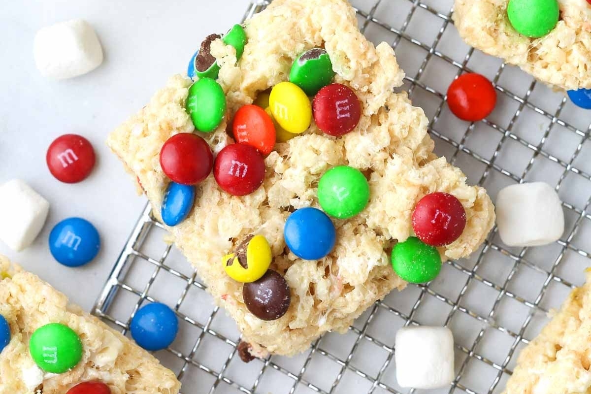 Holiday M&m Rice Krispie treats on a cooling rack.