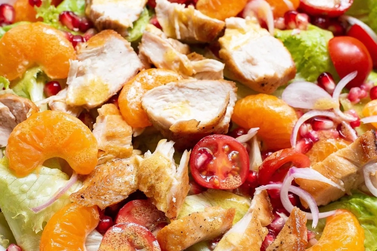 Chicken salad with pomegranate and oranges.
