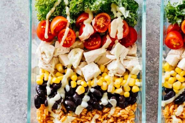 Mexican chicken salad perfect for lunches and meal prep, conveniently stored in a glass container.