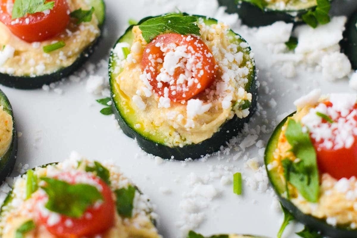 Delicious Zucchini stuffed with feta cheese and tomatoes, perfect for Christmas party appetizers.