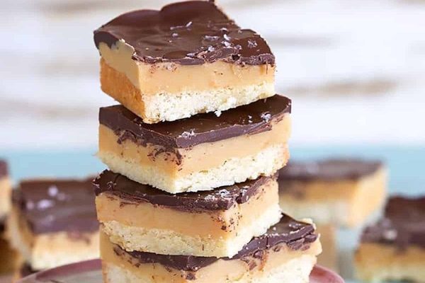 Peanut butter bars stacked on top of each other.
