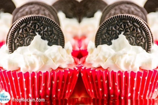 Red Velvet cupcakes with whipped cream and oreo cookies.