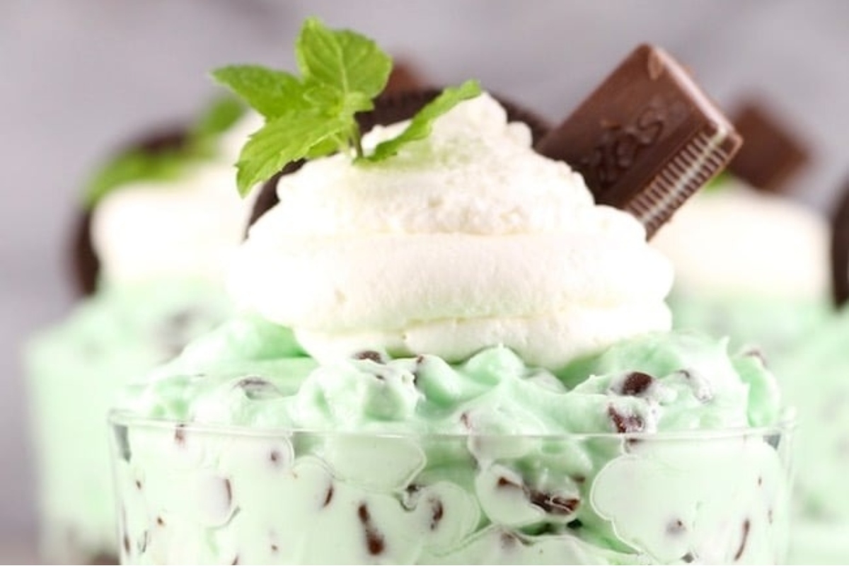 No Bake mint ice cream dessert with whipped cream and Oreos, perfect for holiday desserts.