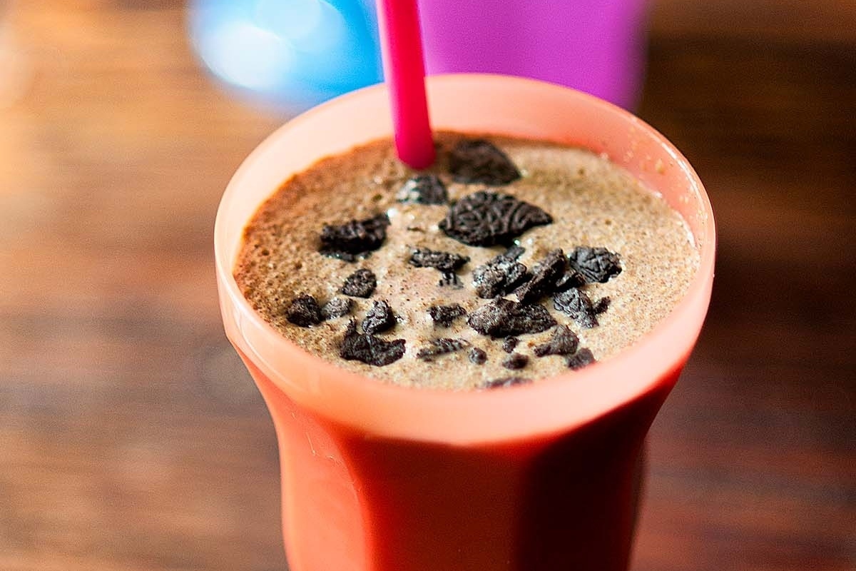 Try out this delicious Oreo smoothie recipe complete with a pink straw for an added touch of fun!