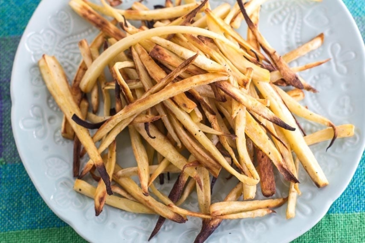 Delicious fry recipes featuring roasted french fries on a white plate.