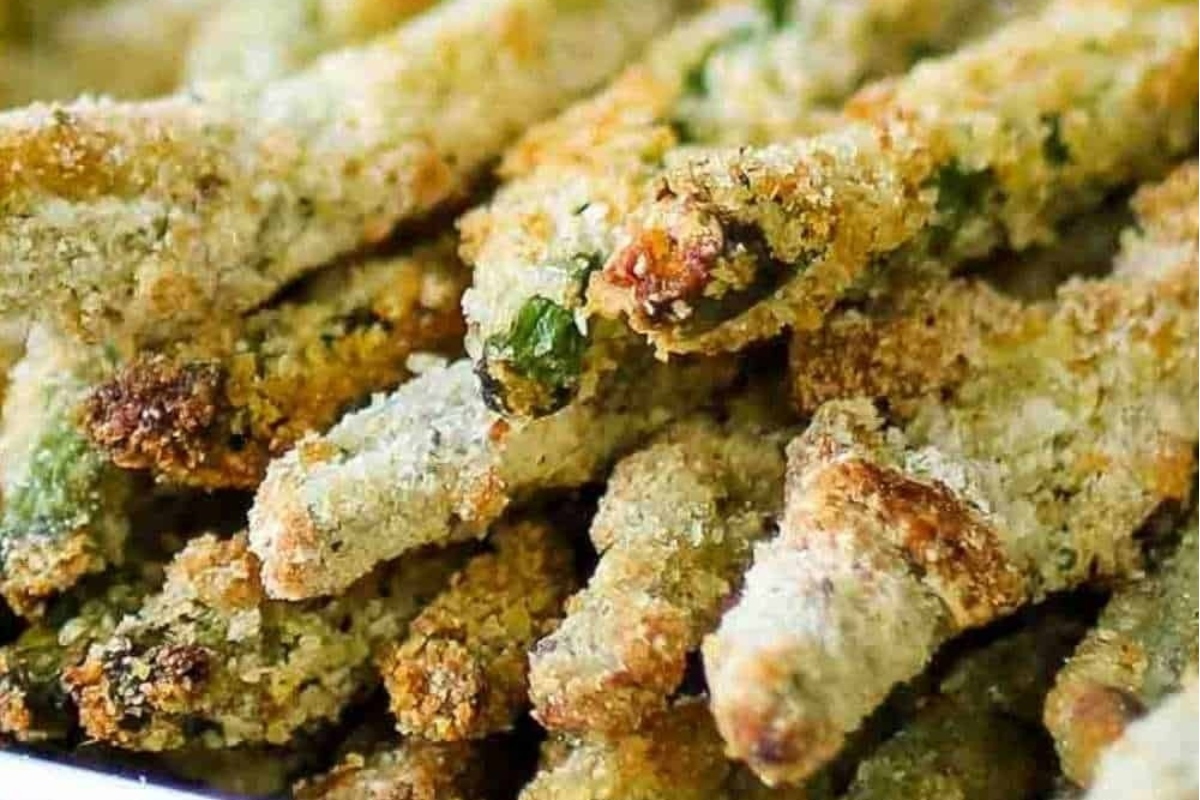 A plate full of fried asparagus in a white dish, perfect for Fry Recipes.