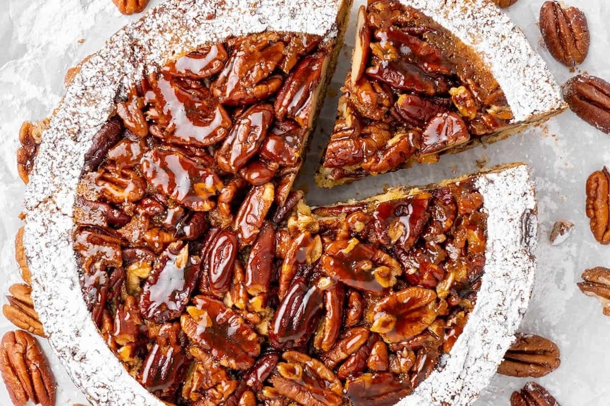 Pecan pie recipe with a slice taken out.