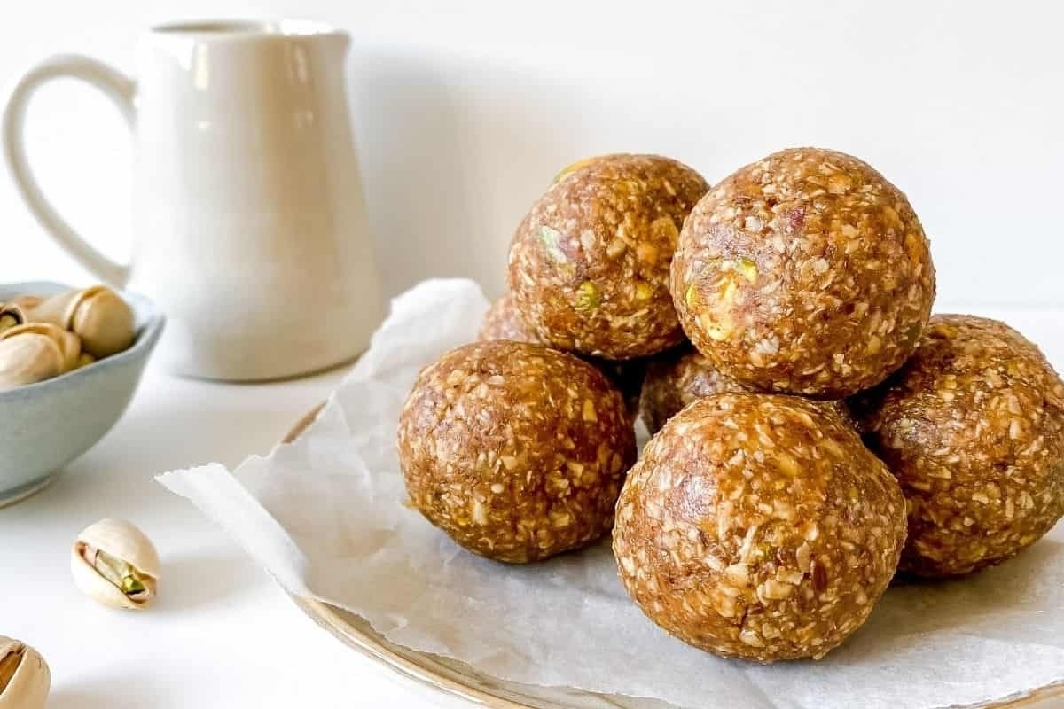 Delicious pistachio energy balls arranged on a plate, perfect for a healthy snack or dessert.
