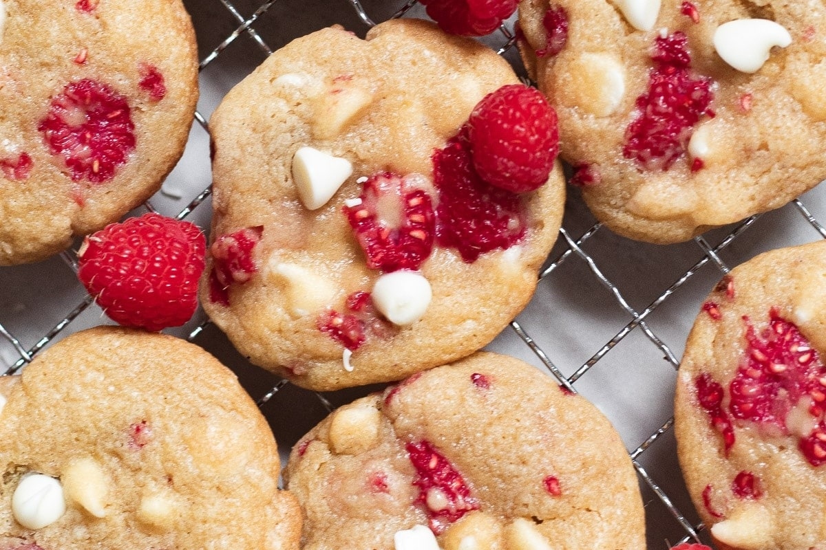 White chocolate raspberry cookies on a cooling rack.