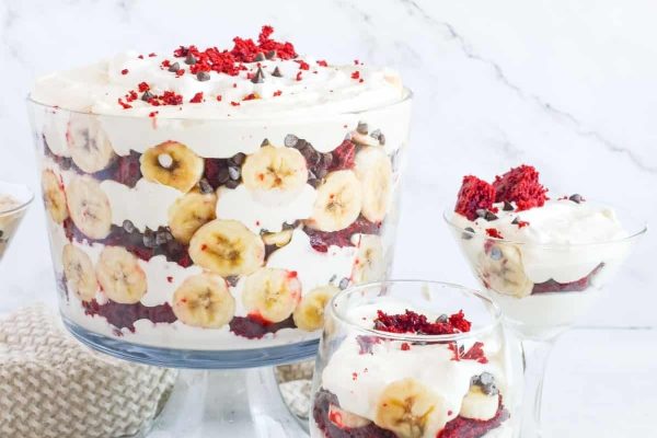 A trifle with bananas, strawberries and raspberries, perfect for dessert.