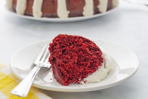 A decadent red velvet bundt cake, elegantly displayed on a plate.