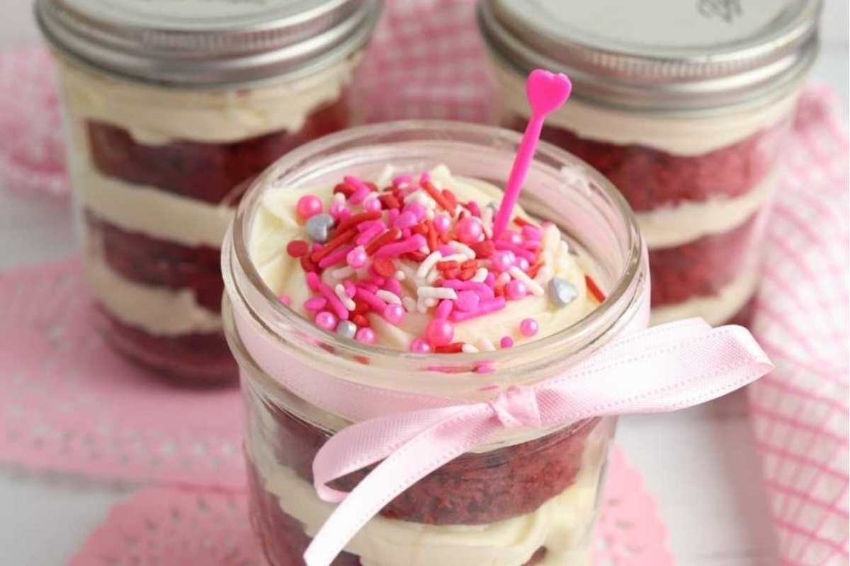 Red velvet cupcakes trifles in mason jars.