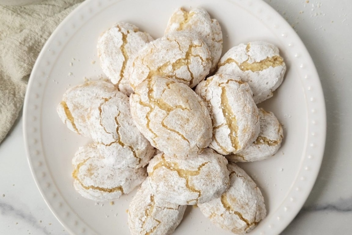 Italian lemon crinkle cookies on a white plate.