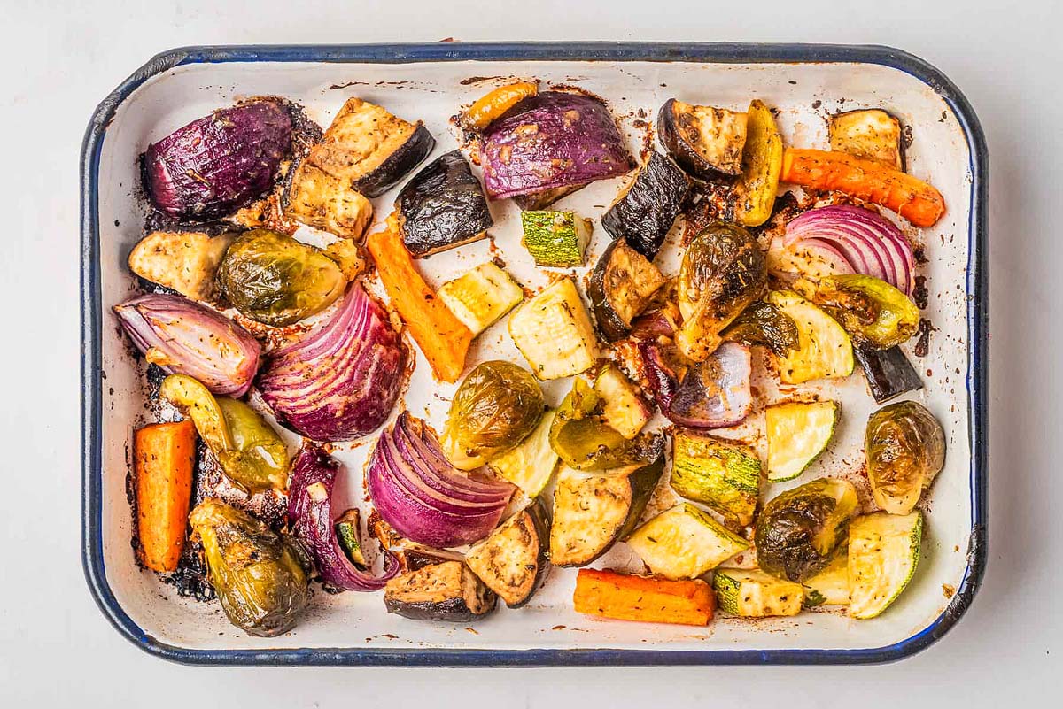 Roasted vegetables in a baking dish.