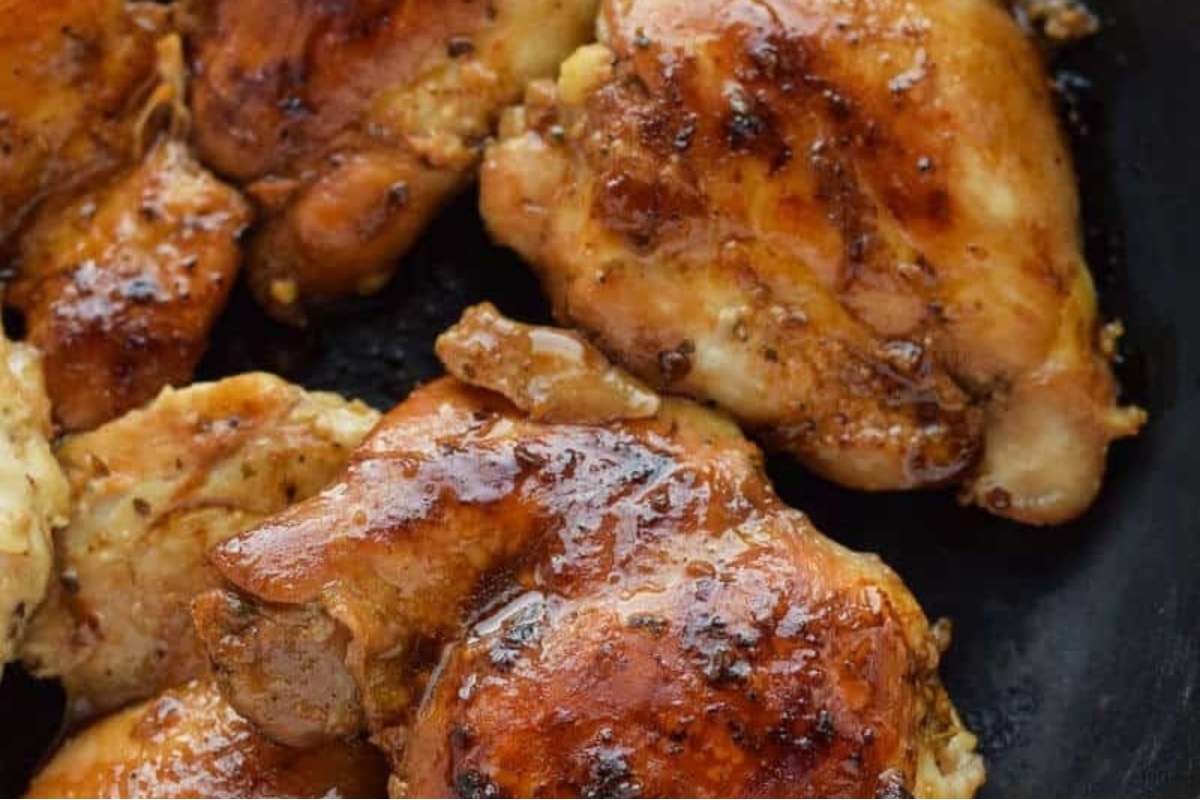 Picky Eater Recipes: Tasty chicken thighs in a skillet with sauce.