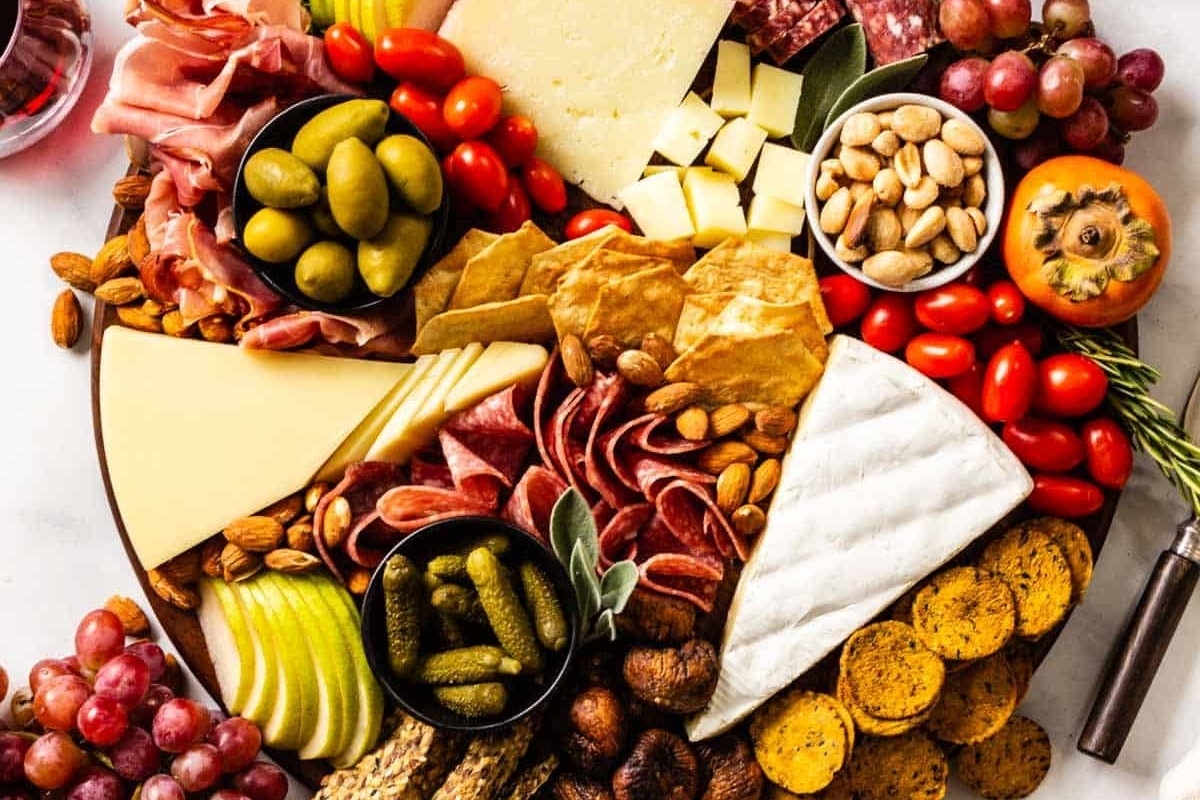 A Christmas charcuterie board featuring a variety of meats and cheeses.