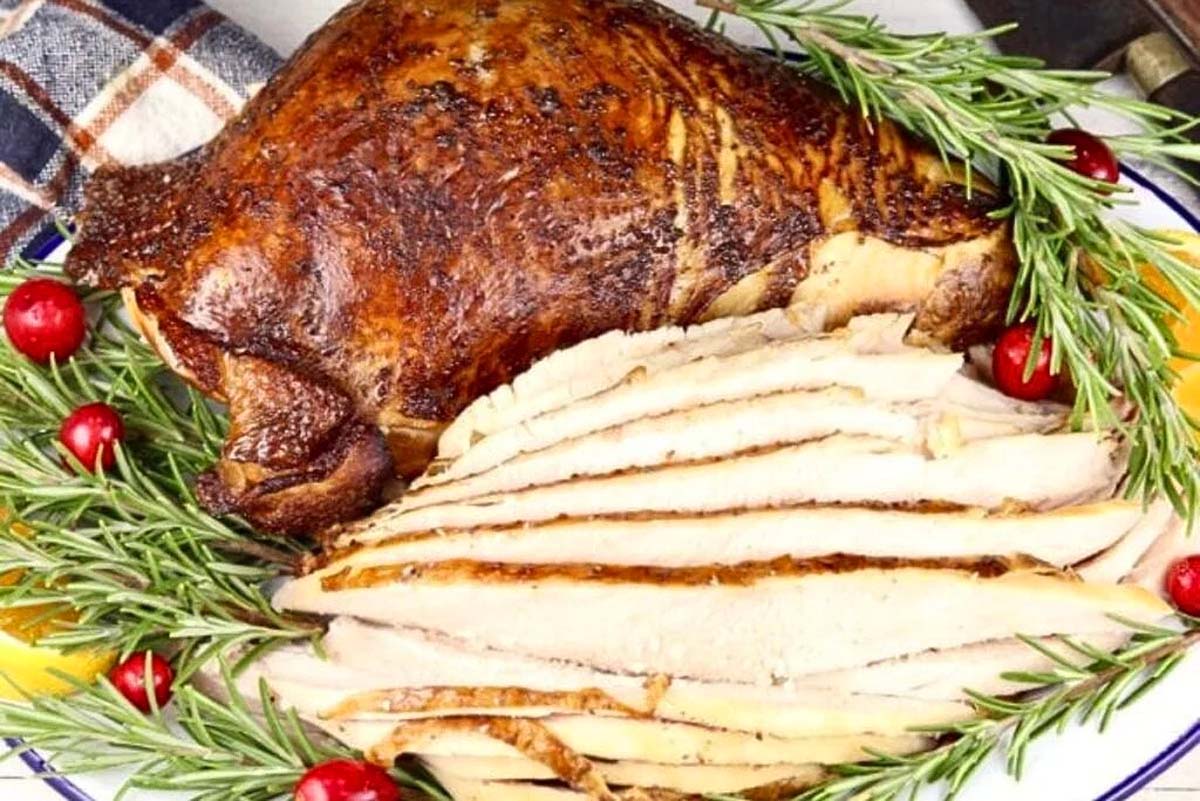 A grilled turkey on a platter.