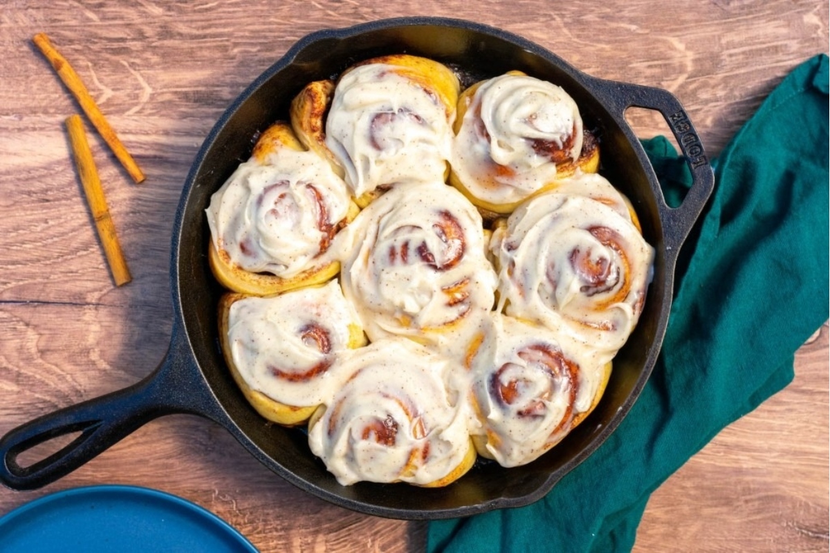 Country style cinnamon rolls cooked in a cast iron skillet.
