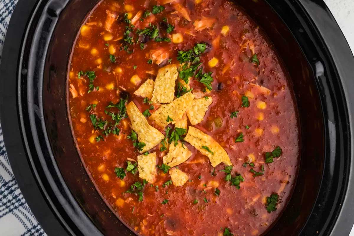 A slow cooker filled with flavorful Mexican soup.