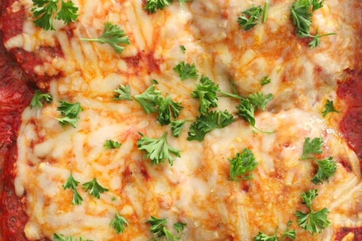 Winter lasagna recipe with cheesy baked layers and parsley.