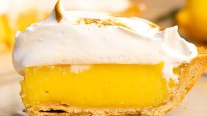 A slice of lemon pie with meringue on top.