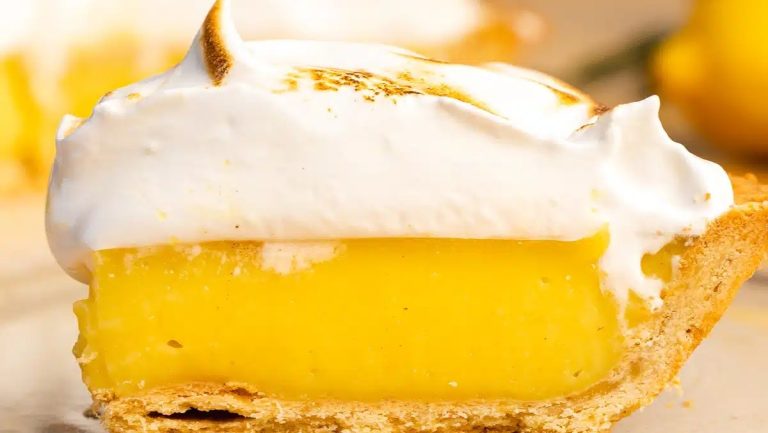 A slice of lemon pie with meringue on top.