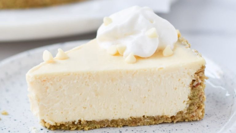 A delectable slice of white chocolate cheesecake on a plate.