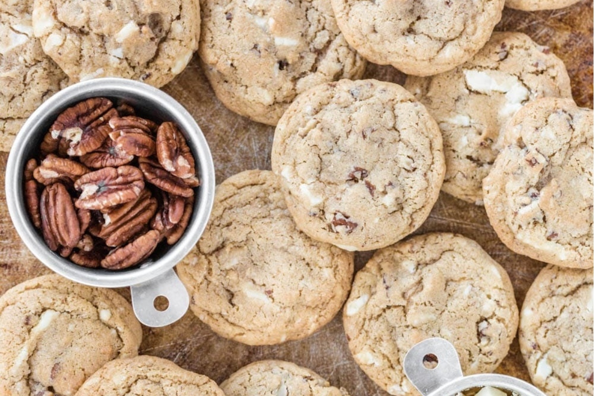 White chocolate pecan cookies, made with a delightful white chocolate recipe and packed with crunchy pecans.