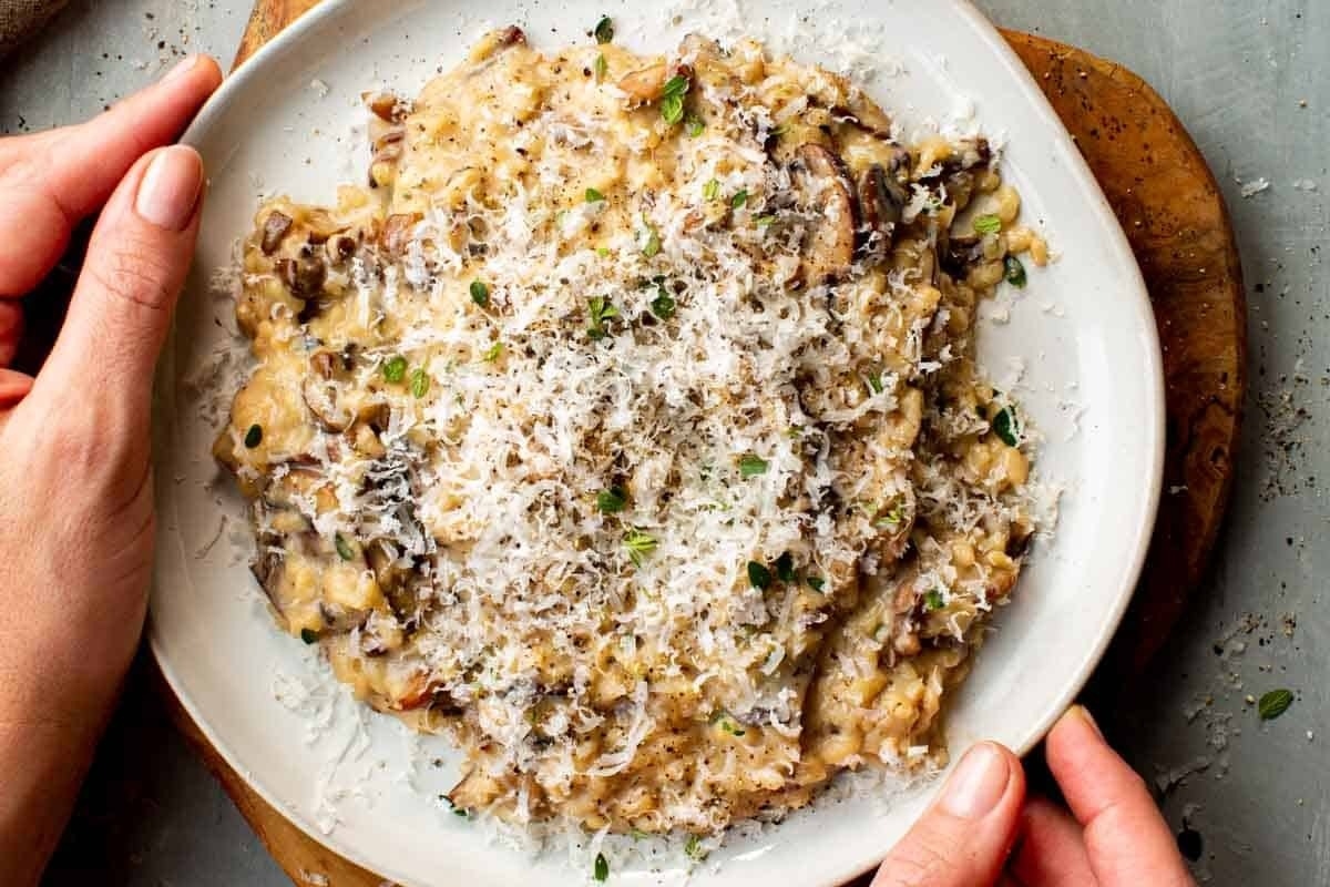 Mushroom risotto with parmesan on a plate.