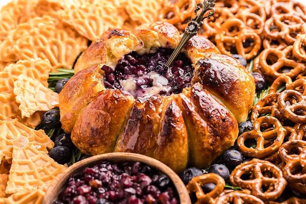 49 Blissfully Tasty Blueberry Recipes 1 A delectable blueberry cheesecake with a unique twist, featuring the perfect combination of crunchy pretzels and pretzel sticks incorporated into its fluffy texture.