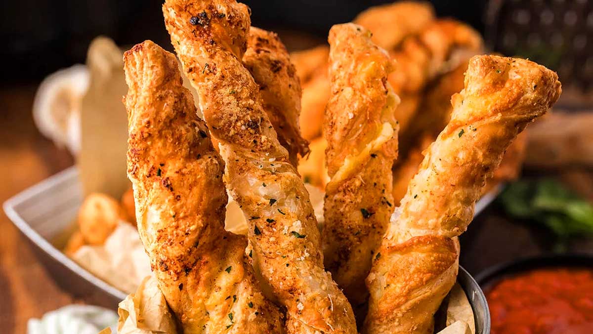Christmas party appetizers - Cheesy garlic bread sticks in a basket.