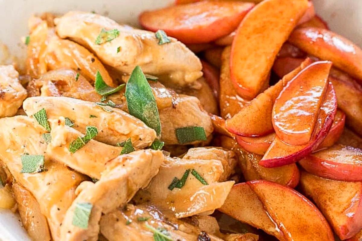 22 Amazing Apple Cider Recipes You Have to Try 19 Chicken with apple cider in a white bowl.