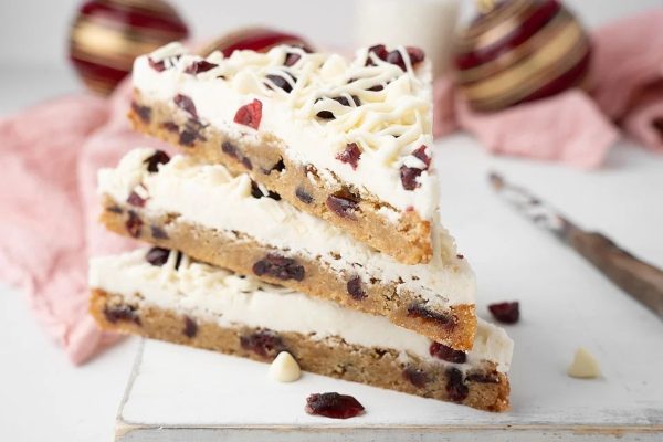 A stack of cranberry and white chocolate bars, perfect for holiday recipes.