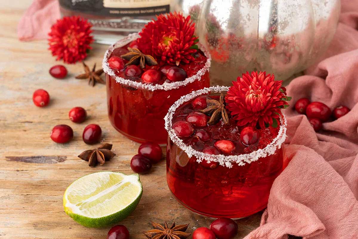         Fall cocktails: Cranberry margaritas with cranberries and cinnamon.