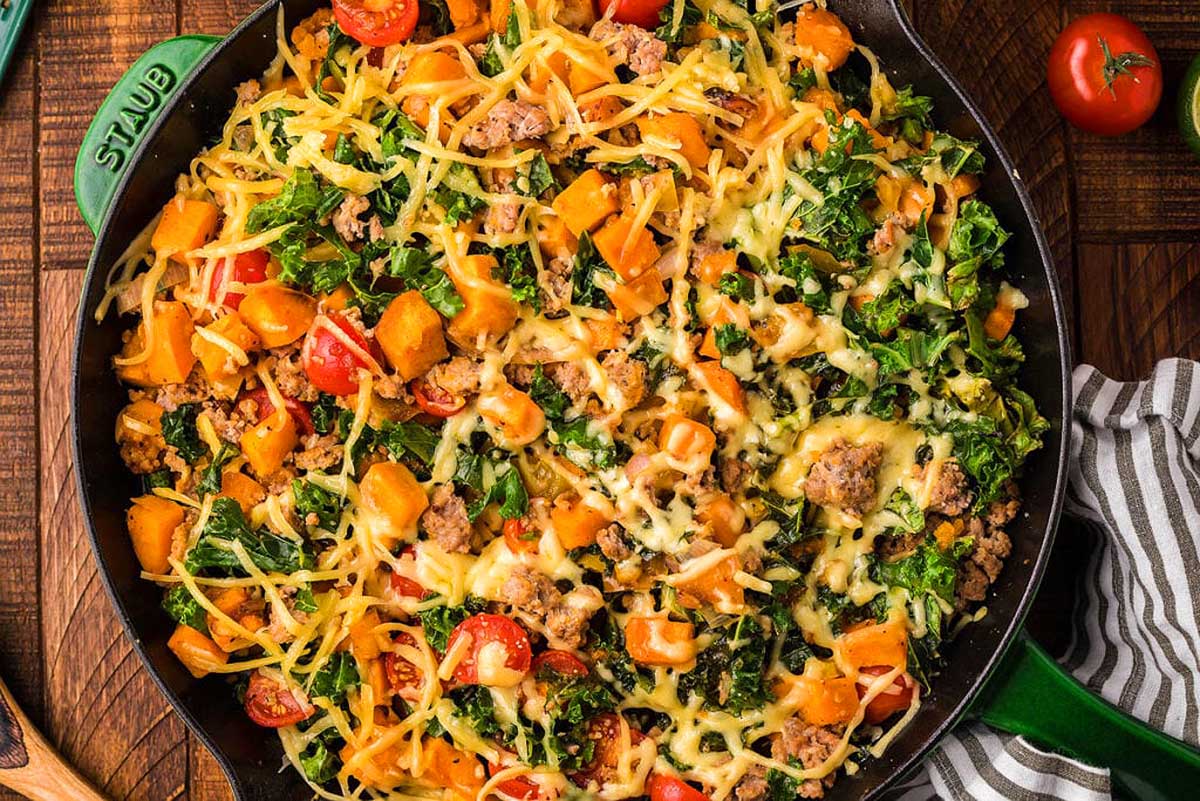 A skillet full of vegetables, meat and cheese. This is one of the best skillet recipes.
