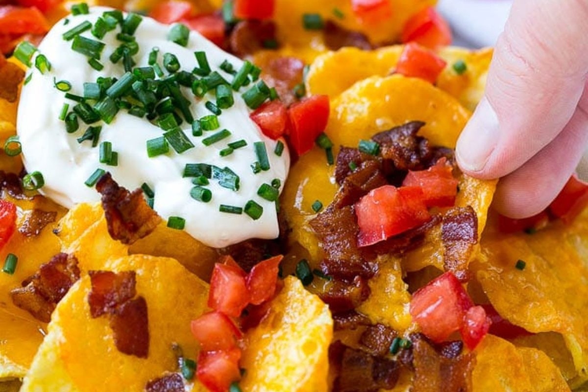Bacon nachos with sour cream and chives.
