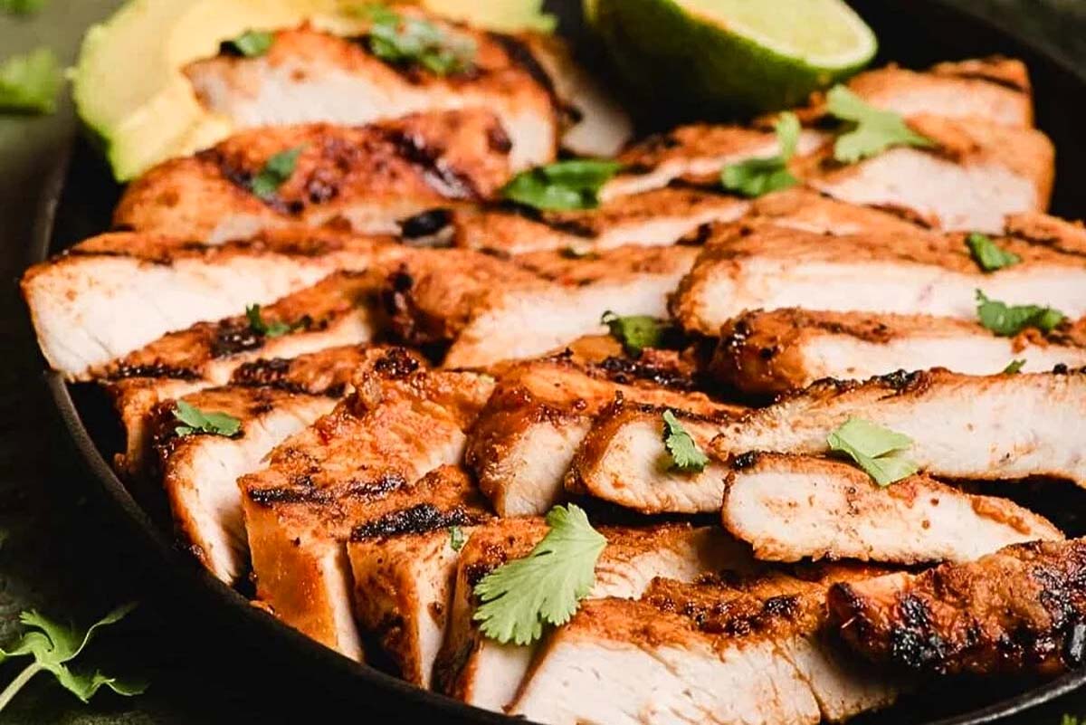 Grilled turkey sliced on a plate.