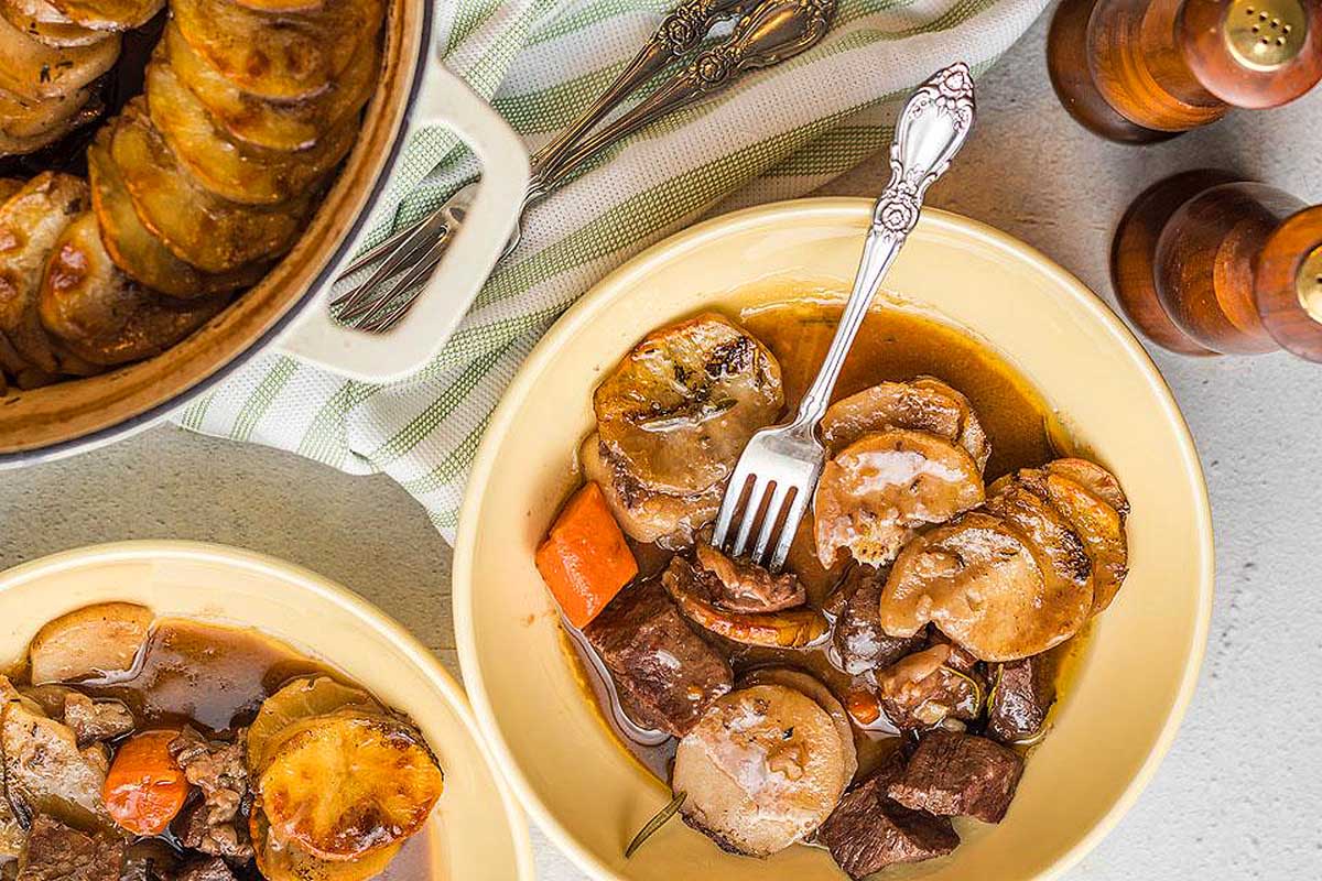 Irish stew in a bowl with potatoes and carrots.
