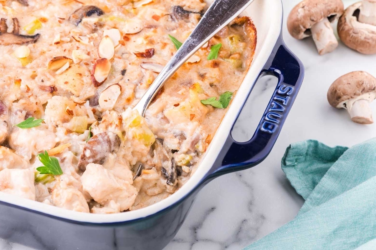 Chicken and mushroom casserole in a blue dish, perfect for comforting winter dinners.