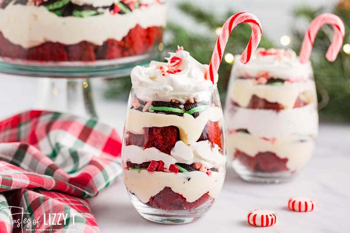 Christmas red velvet trifle in glasses with candy canes.