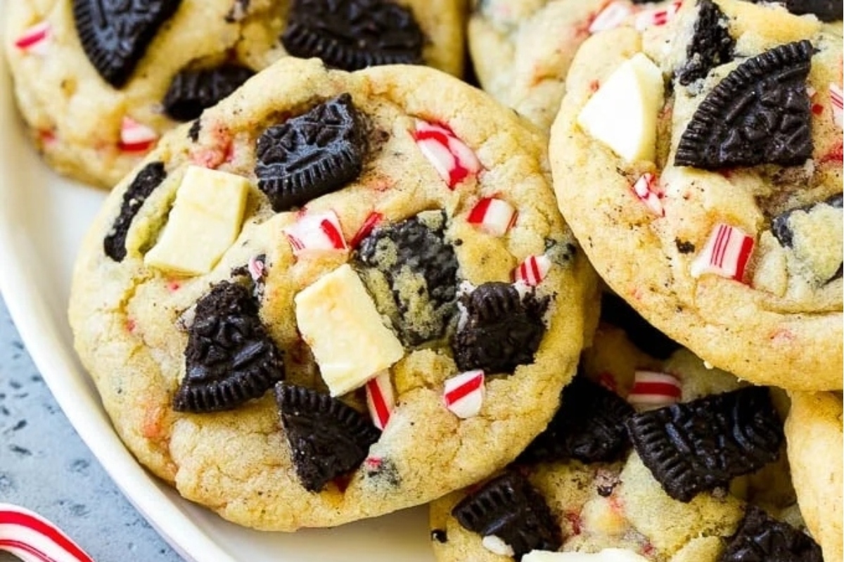 Christmas-themed Oreo cookies with peppermint candies on a plate.