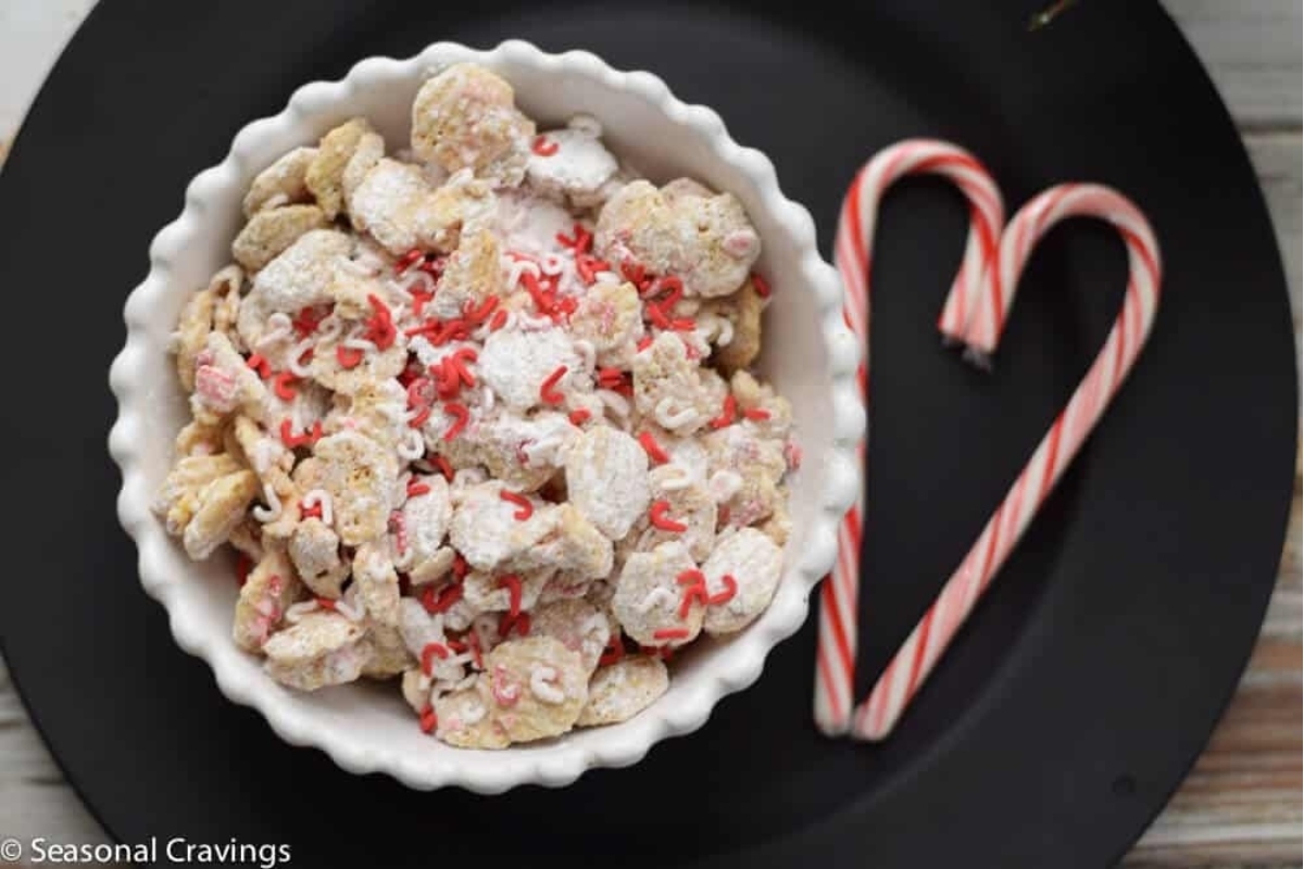 A bowl of cereal with candy canes on it.