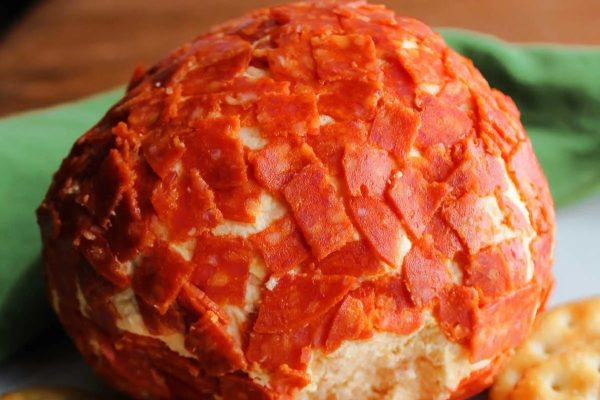 Cheese Ball Recipe: A delicious combination of cheese ball, pepperoni, and crackers arranged on a plate.