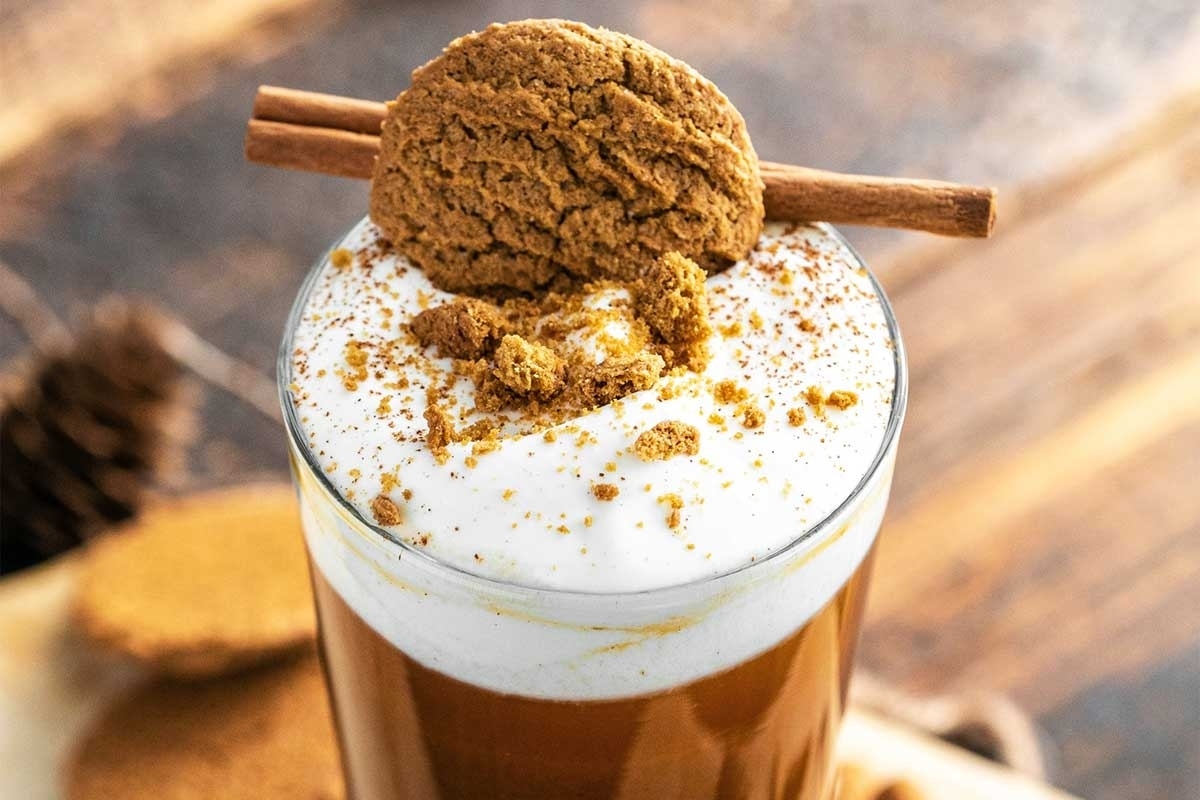 Pumpkin pie cocktail with cookie on top.