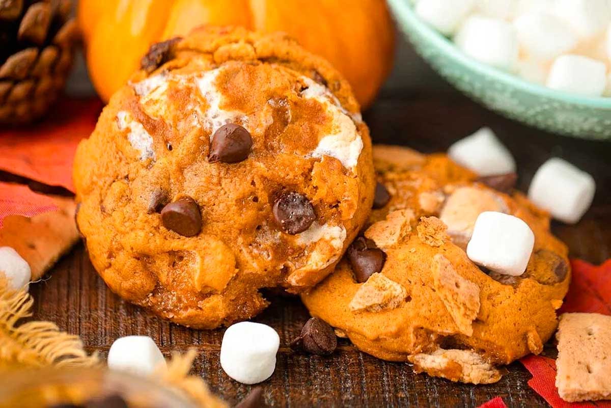 S'mores pumpkin cookies with marshmallows and graham crackers. This is one of the best fall cookie recipes.