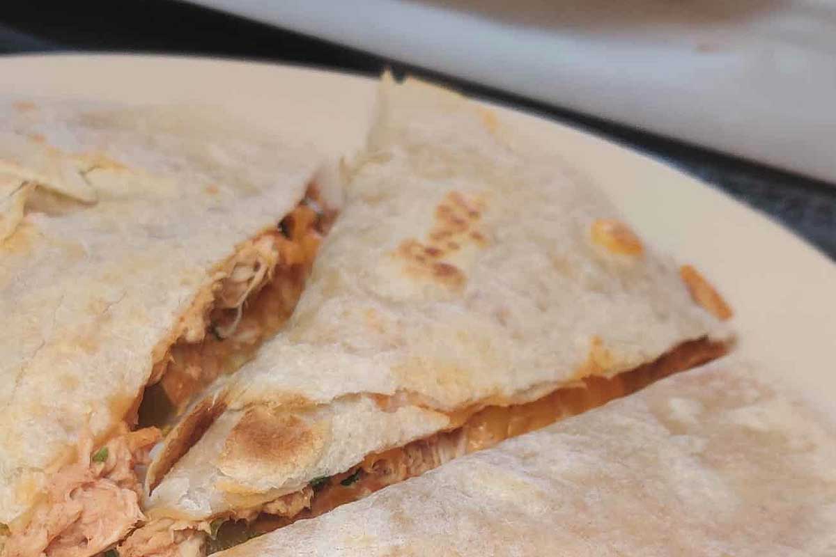 Chicken quesadillas on a white plate.