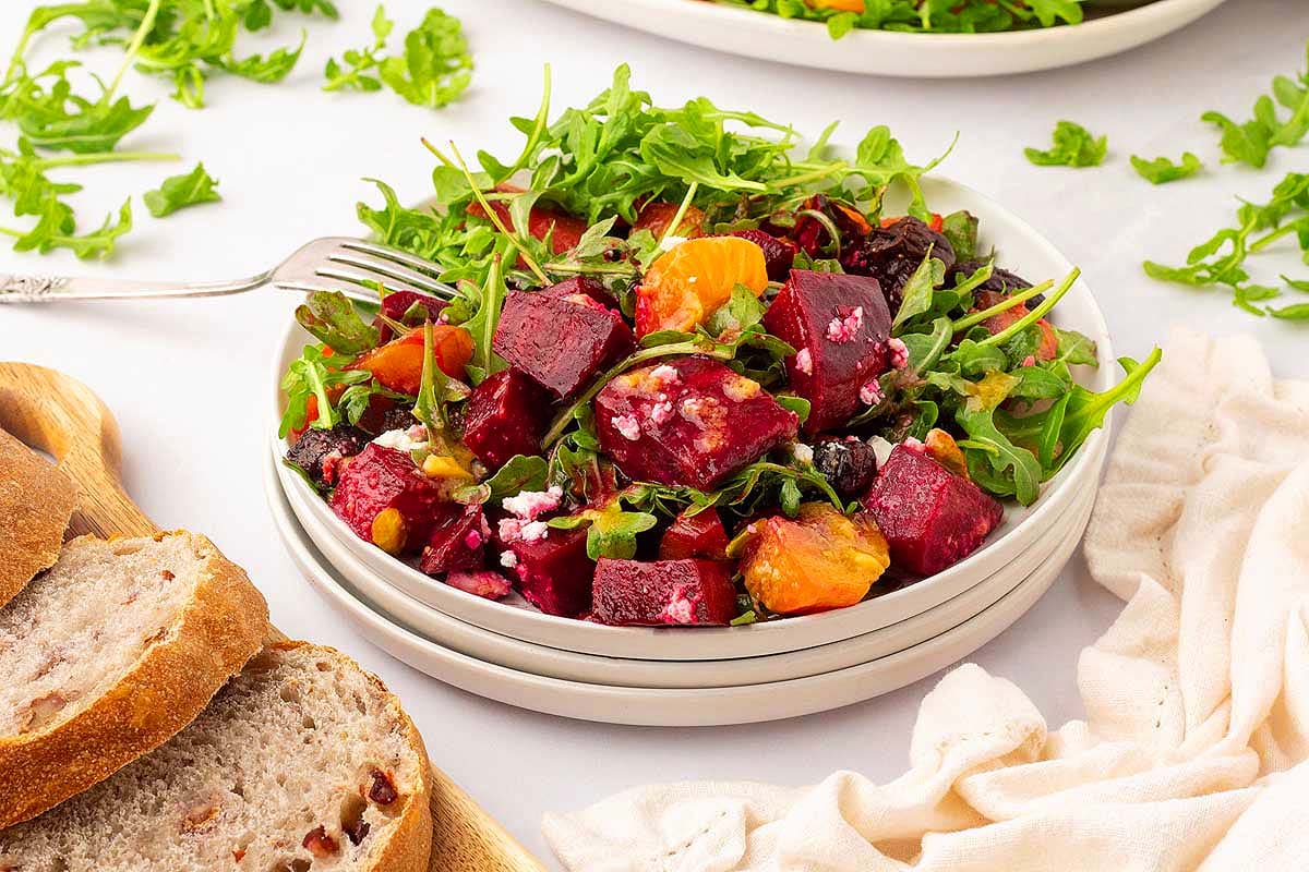 A bowl of beet salad with Sides.